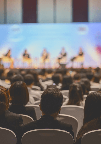 audience watching a panel session