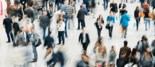 action shot of people walking in an event space
